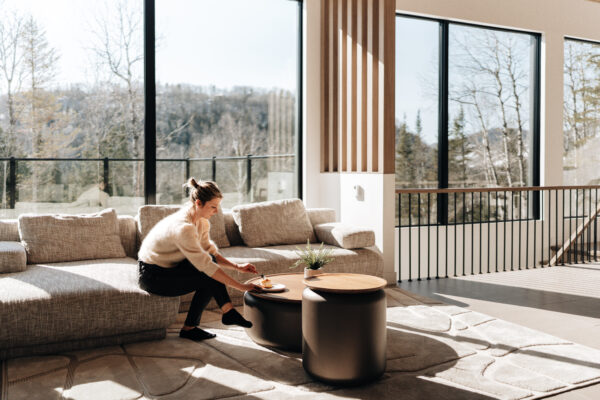 Living room with fireplace and nature view